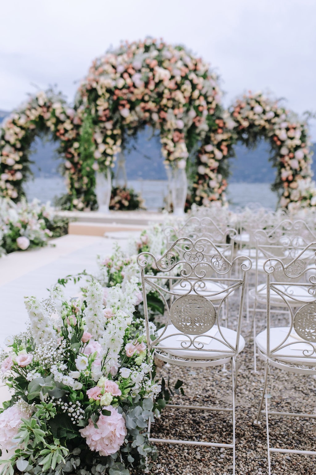 Arches and chairs at ceremony on Lake Garda