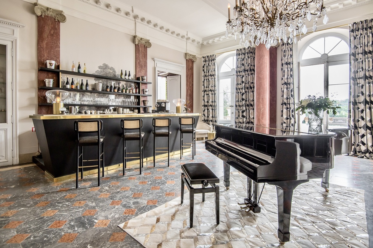 Bar and piano living room at luxury chateau in France