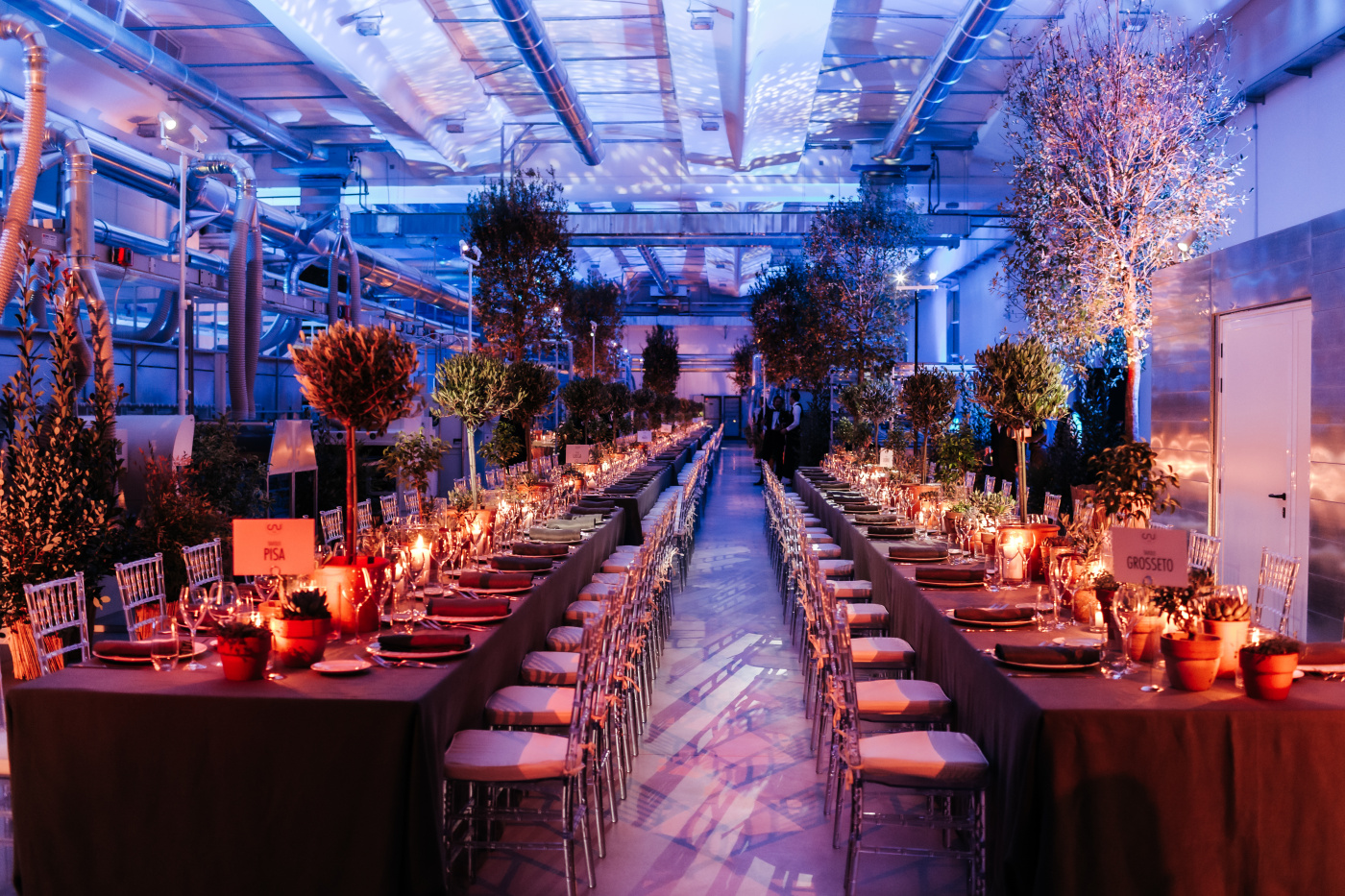 Two long rectangular tables for a corporate event dinner