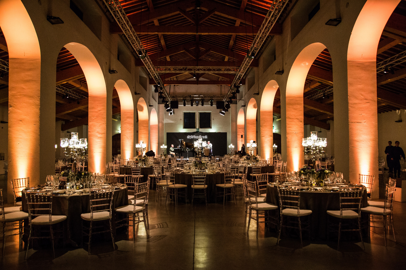 Corporate event in Florence with round tables and candelabras
