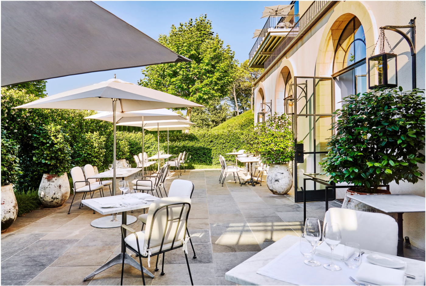 External garden of restaurant at luxury wedding estate in France