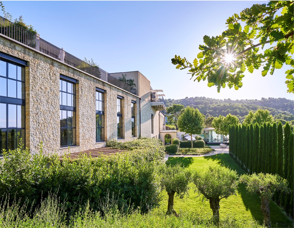 Facade of villa suites and garden of luxury castle France for ceremony