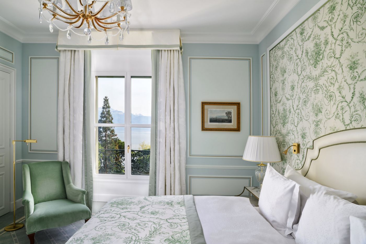 Green and blue bedroom of luxury venue for weddings on Lake Geneva