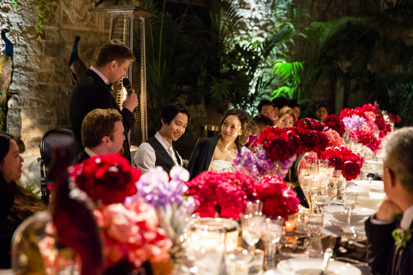 Wedding dinner with jungle themed flowers decor