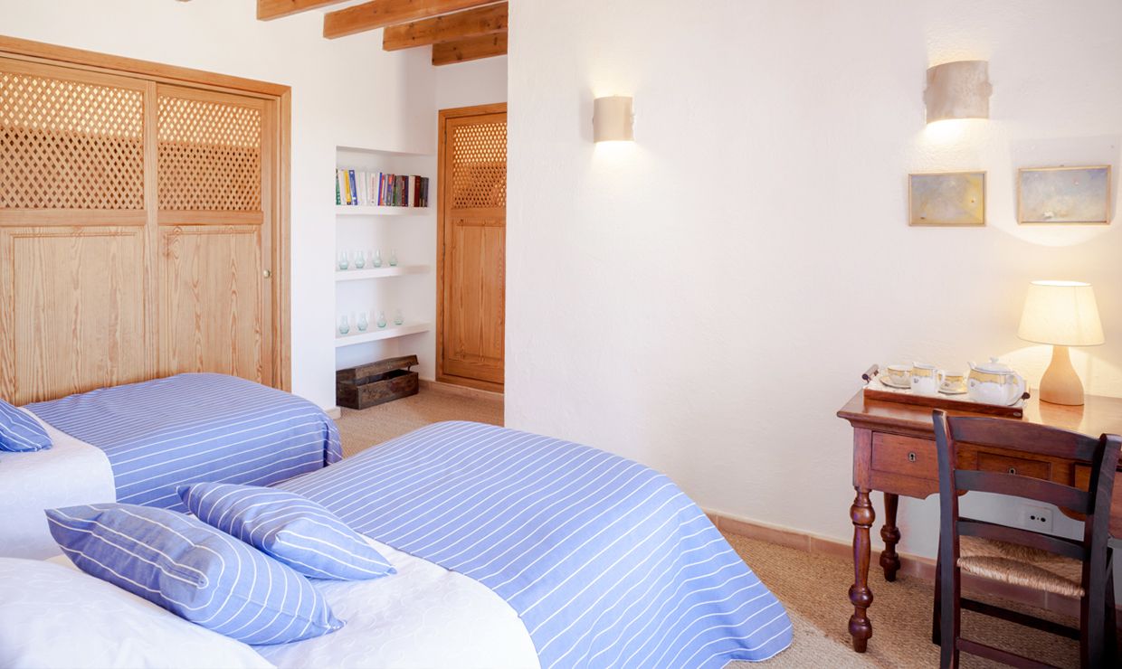 Light blue and white wooden bedroom at luxury villa for weddings in Mallorca