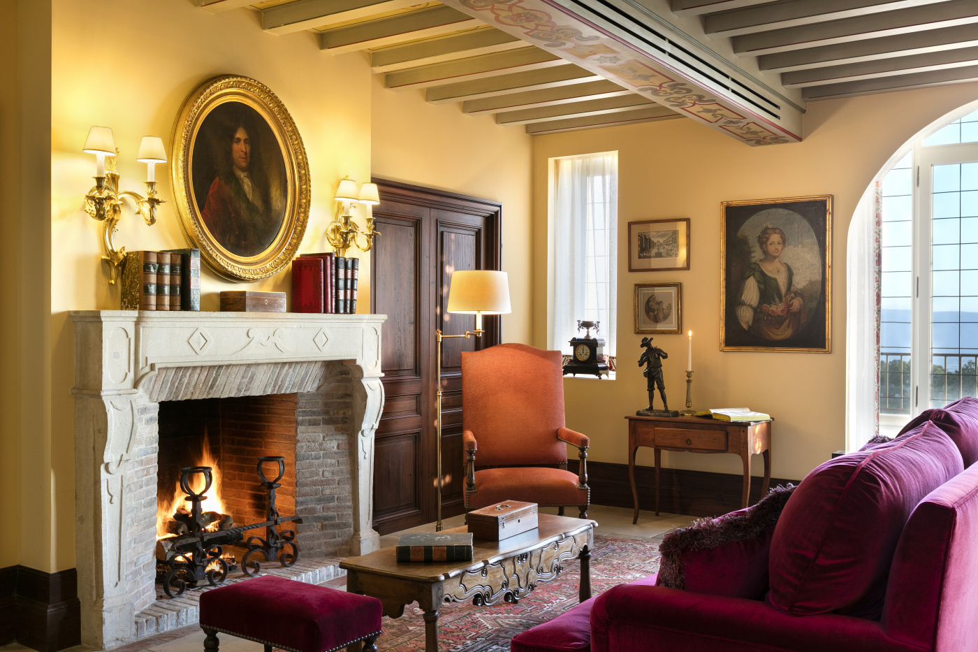 Living room with fireplace at luxury villa in Provence for wedding