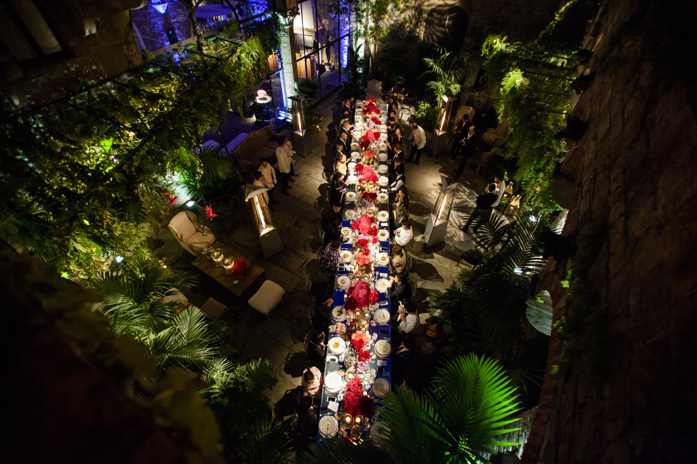 Rectangular table in a castle with plants and greenery