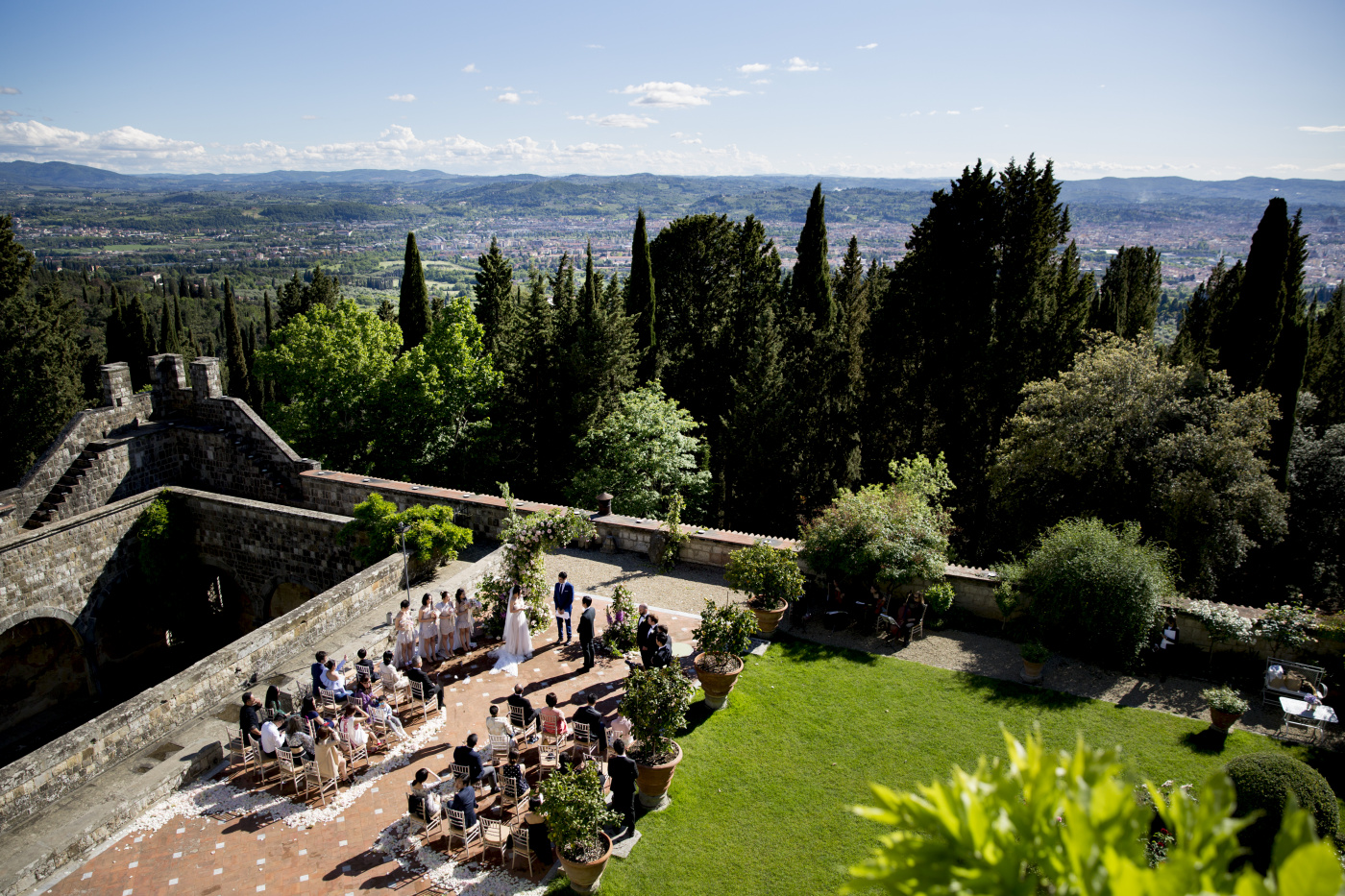 Outdoor ceremony in a garden with view