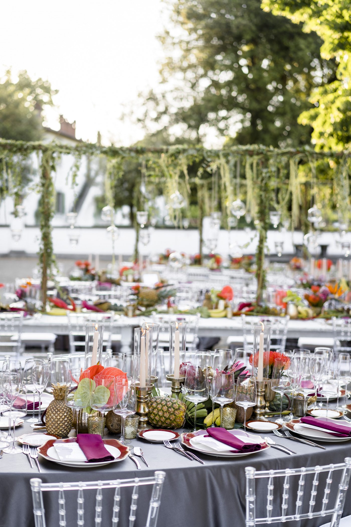 Hanging greenery and candles for a tropical themed birthday party