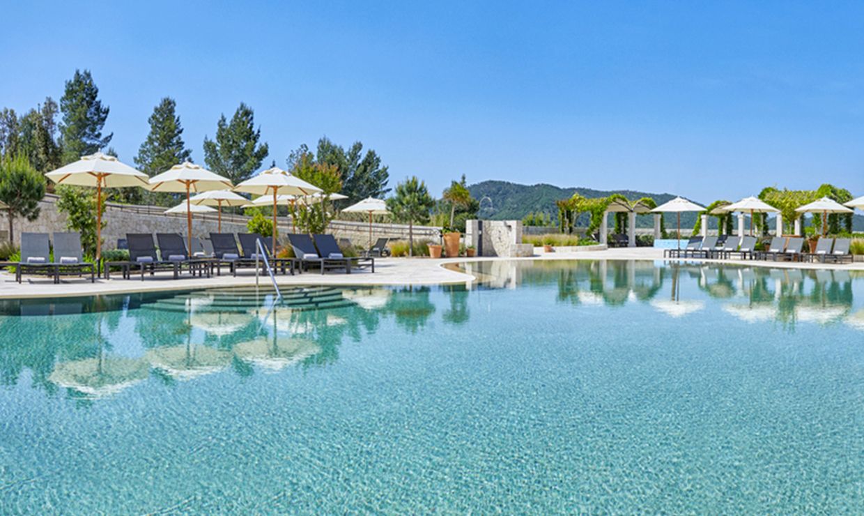 Pool with sun beds at luxury grand hotel village for wedding in Mallorca
