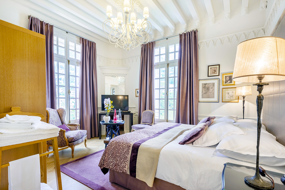 Purple bedroom of luxury Belle Epoque wedding villa on the French Riviera