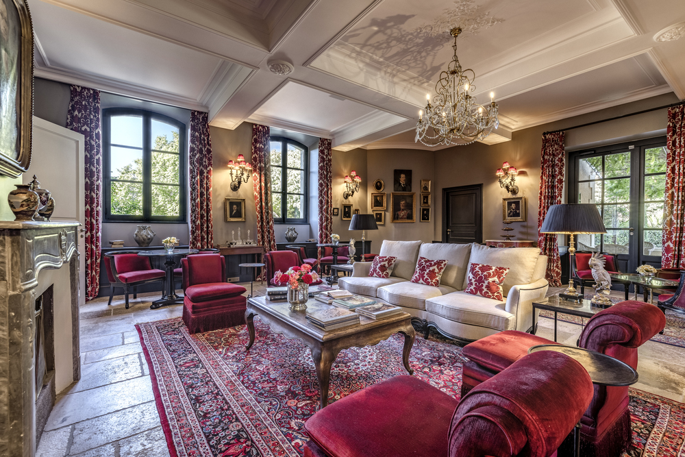Refined burgundy living room of luxury castle d'Estoublon in France