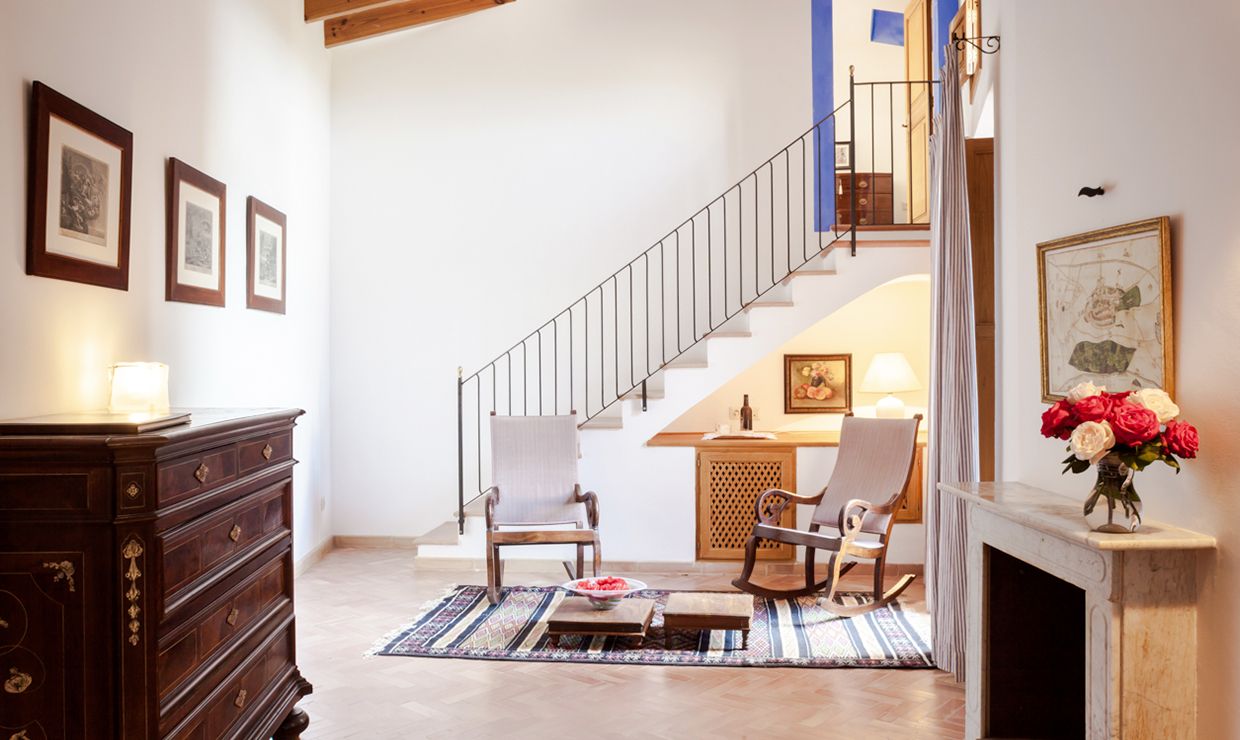 Relax area with armchairs of a bedroom at the luxury villa for weddings in Mallorca