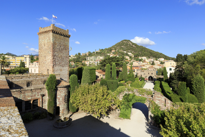 View of courtyard and trees at luxury castle for weddings in Provence