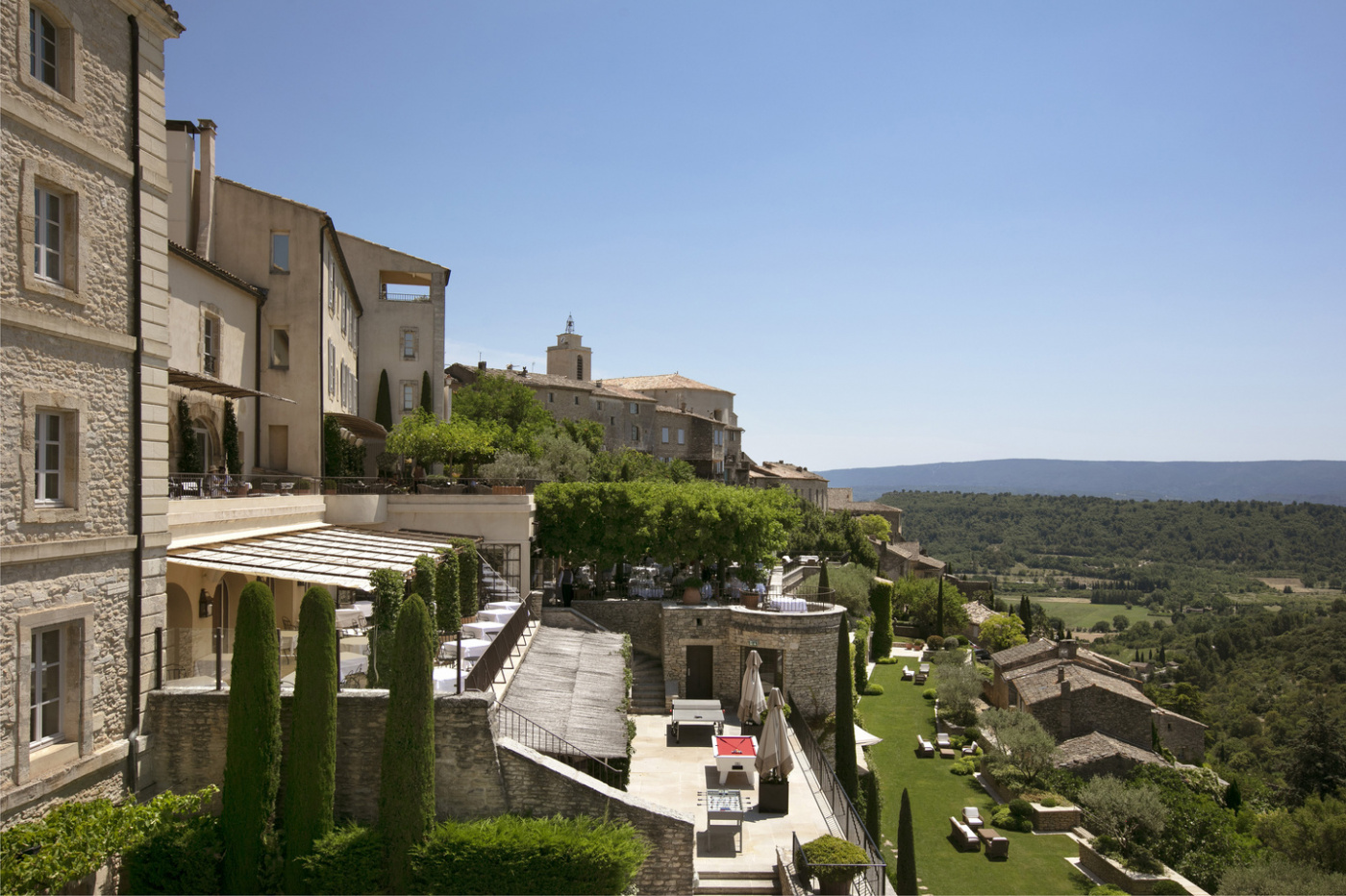 View of garden and facade of luxury venue in Provence with chef