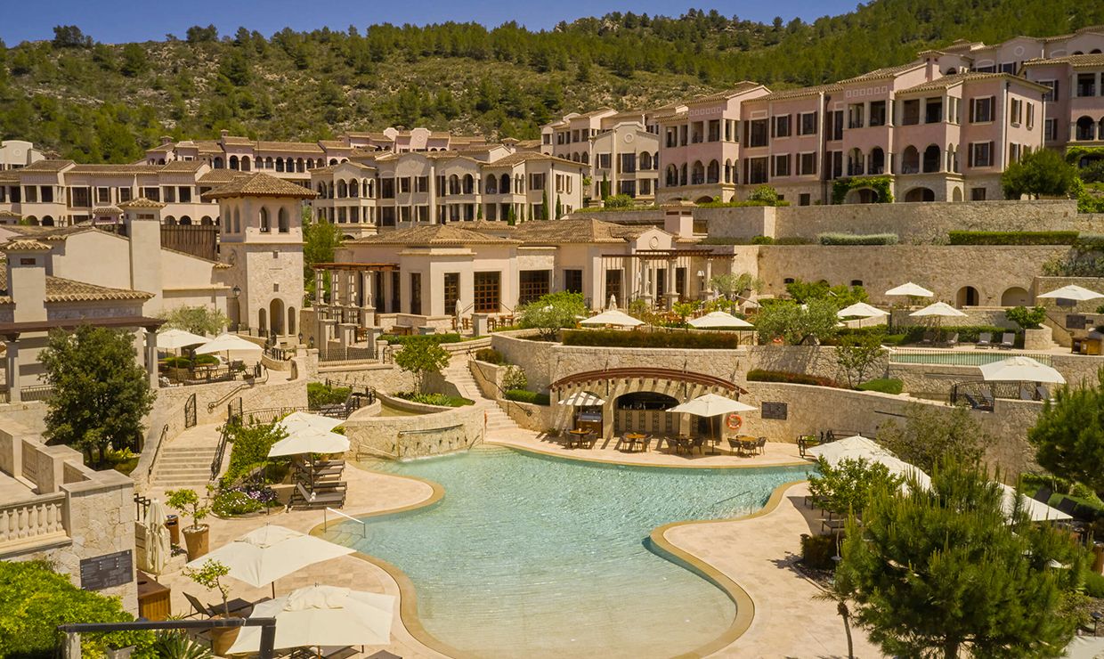 View of pool and village at grand hotel for weddings in Mallorca