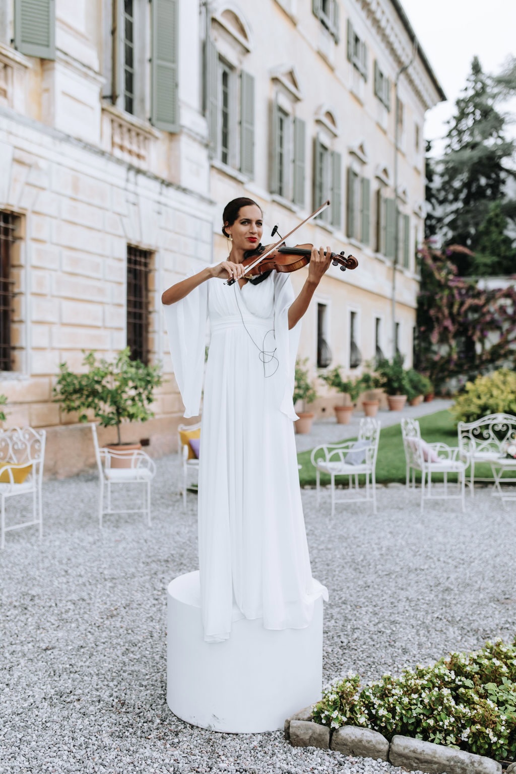 Violinist on podium at Lake Garda wedding