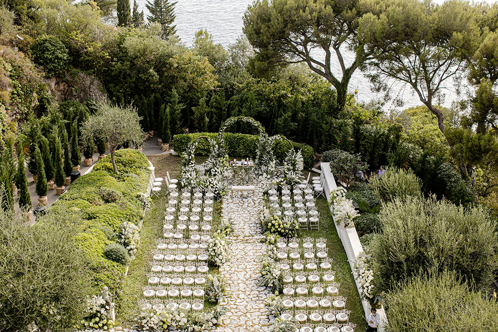 White ceremony in the garden of luxury Belle Epoque La Vigie wedding villa on the French Riviera
