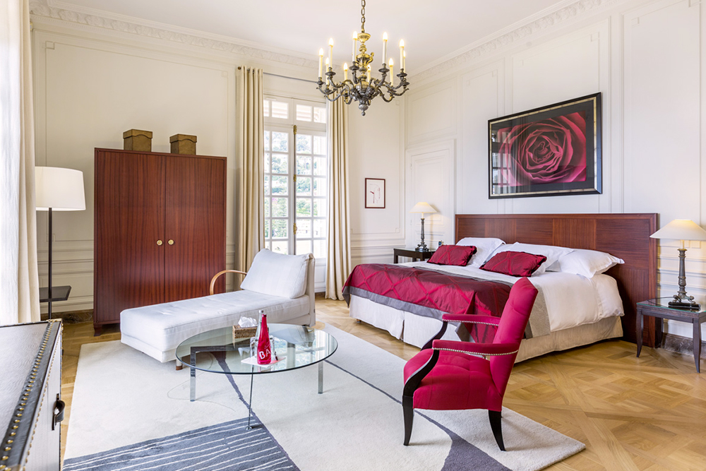 White and red bedroom of luxury Belle Epoque wedding villa on the French Riviera