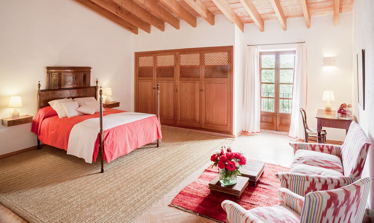 White and red bedroom at luxury villa for weddings in Mallorca